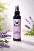 OdorKO Lavender Shield natural odor eliminator spray bottle with lavender flowers on a light background